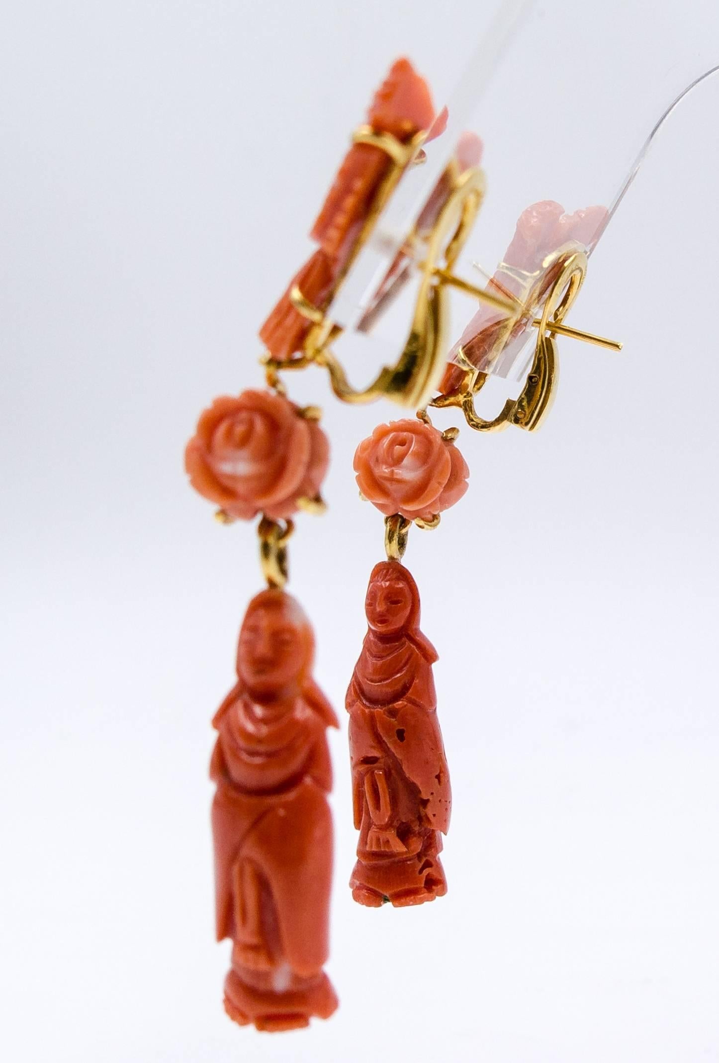   For coral lovers and shoulder duster lovers alike, these distinctive earrings display an interesting range of coral colors.  The Quan Yin statues at the base are a deep and rich orange, while the central flowers are a more delicate shade.  The