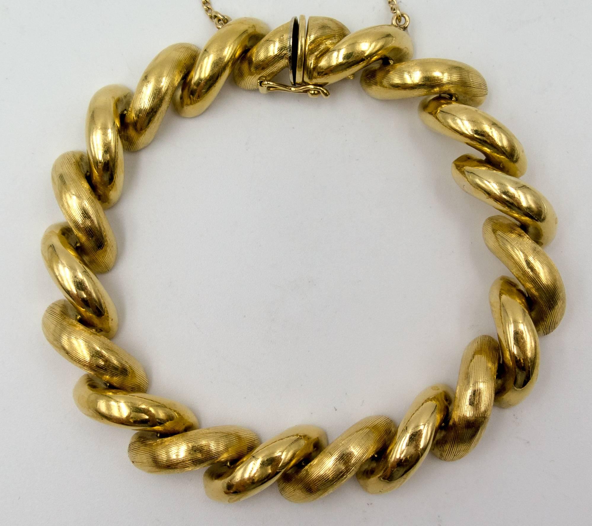   This diagonally arranged line of domed motifs has always been referred to as the San Marco style of bracelet, and this one is a lovely example.   Crafted in 18 karat gold and made in Arezzo,Italy by one of the most well known gold jewelry design