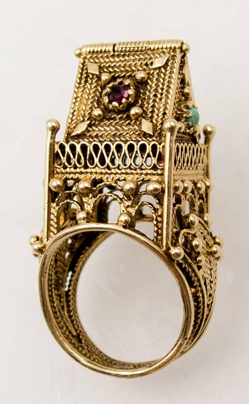 Although this highly unusual ring was probably made in the 1950's, it's a duplicate of Jewish marriage rings dating back to the 10th century and most prominent in Medieval Europe in the 13th and 14th centuries.   The house sitting atop the finger,