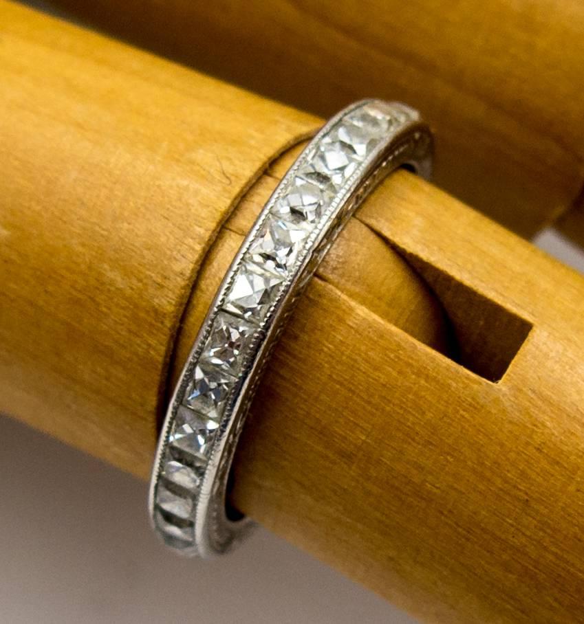 Its rare to find these lovely little platinum bands set with  French cut diamonds, but here's one in a very wearable size 5 1/2.    It contains 29 beautifully chunky and sparkling French cut diamonds totalling about 1 1/2 carats, set it a channel