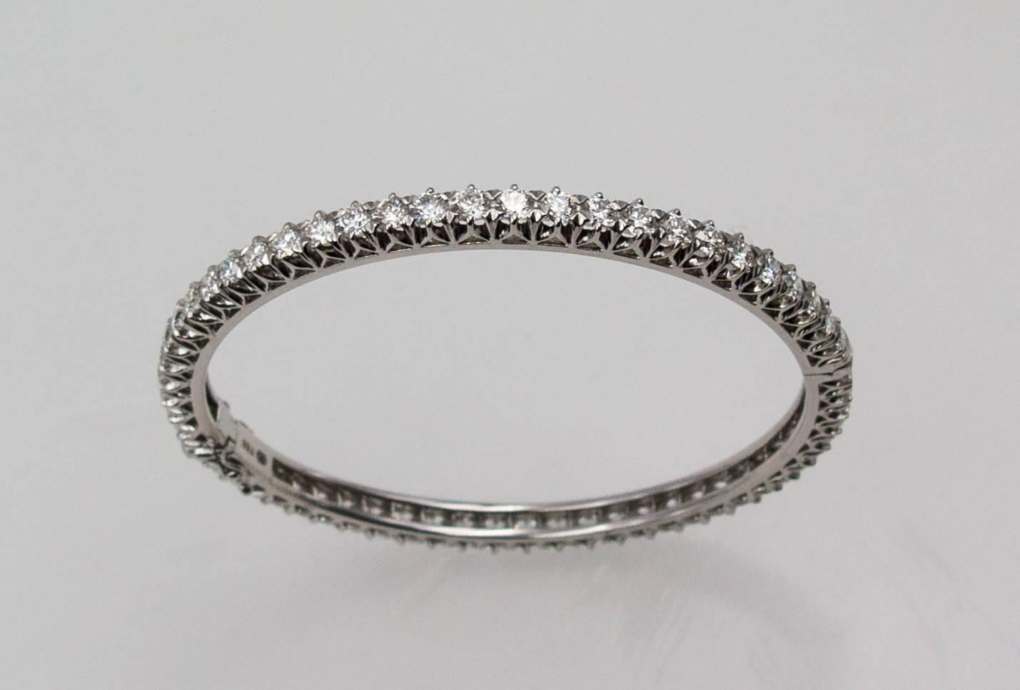 Timeless and eminently wearable, a bangle bracelet is like a diplomatic passport:  it goes anywhere, day or night, with no questions asked.   This gorgeous bangle is crafted in 18 karat white gold and set with 58 round modern brilliant cut high