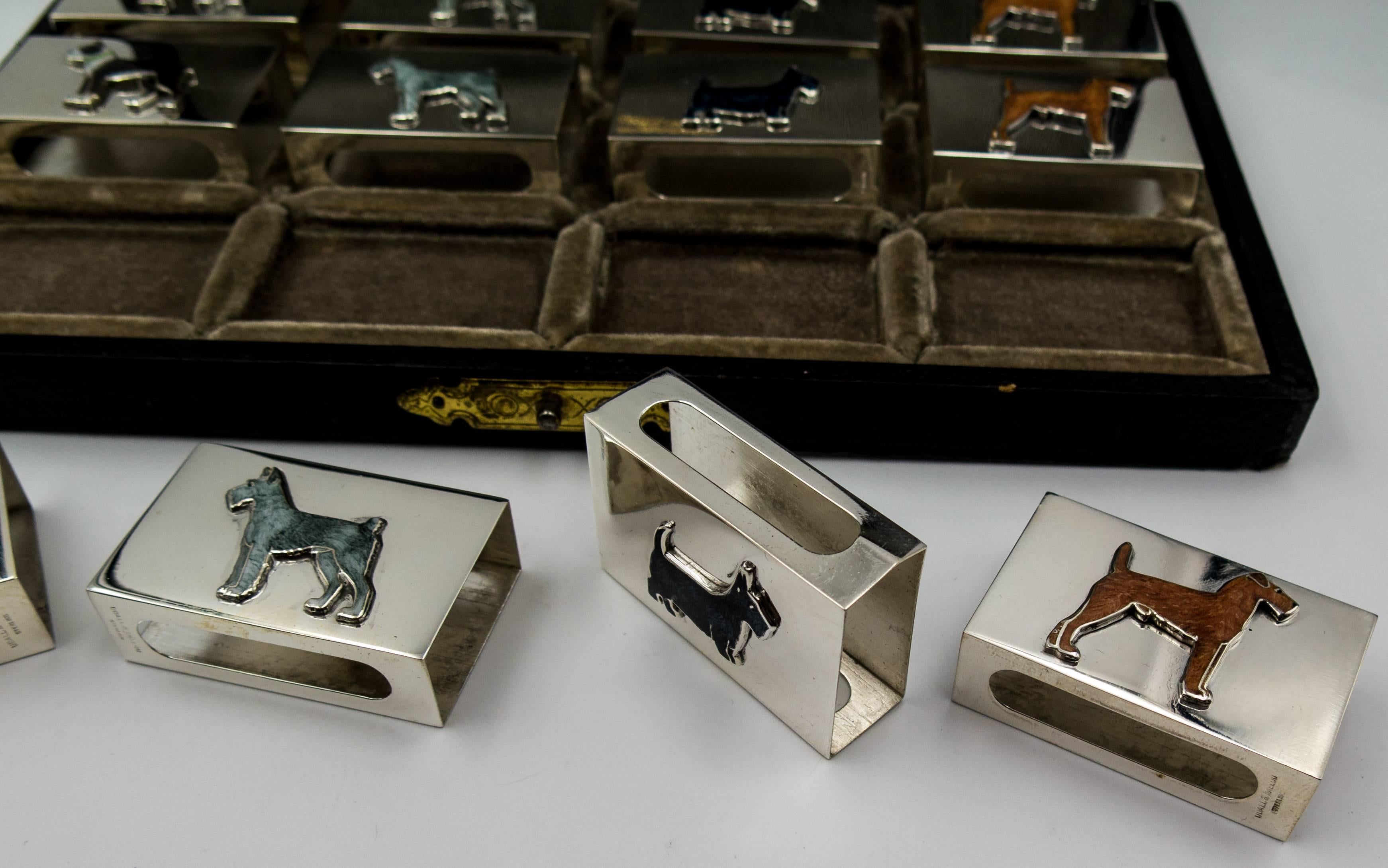   An elegant jewel for the desk or dinner table, this unusual item consists of 12 individual matchbox holders crafted in silver.  Nestled within the box are four  breeds of sporting dog, three matchboxes for each, all handpainted.  The boxer is