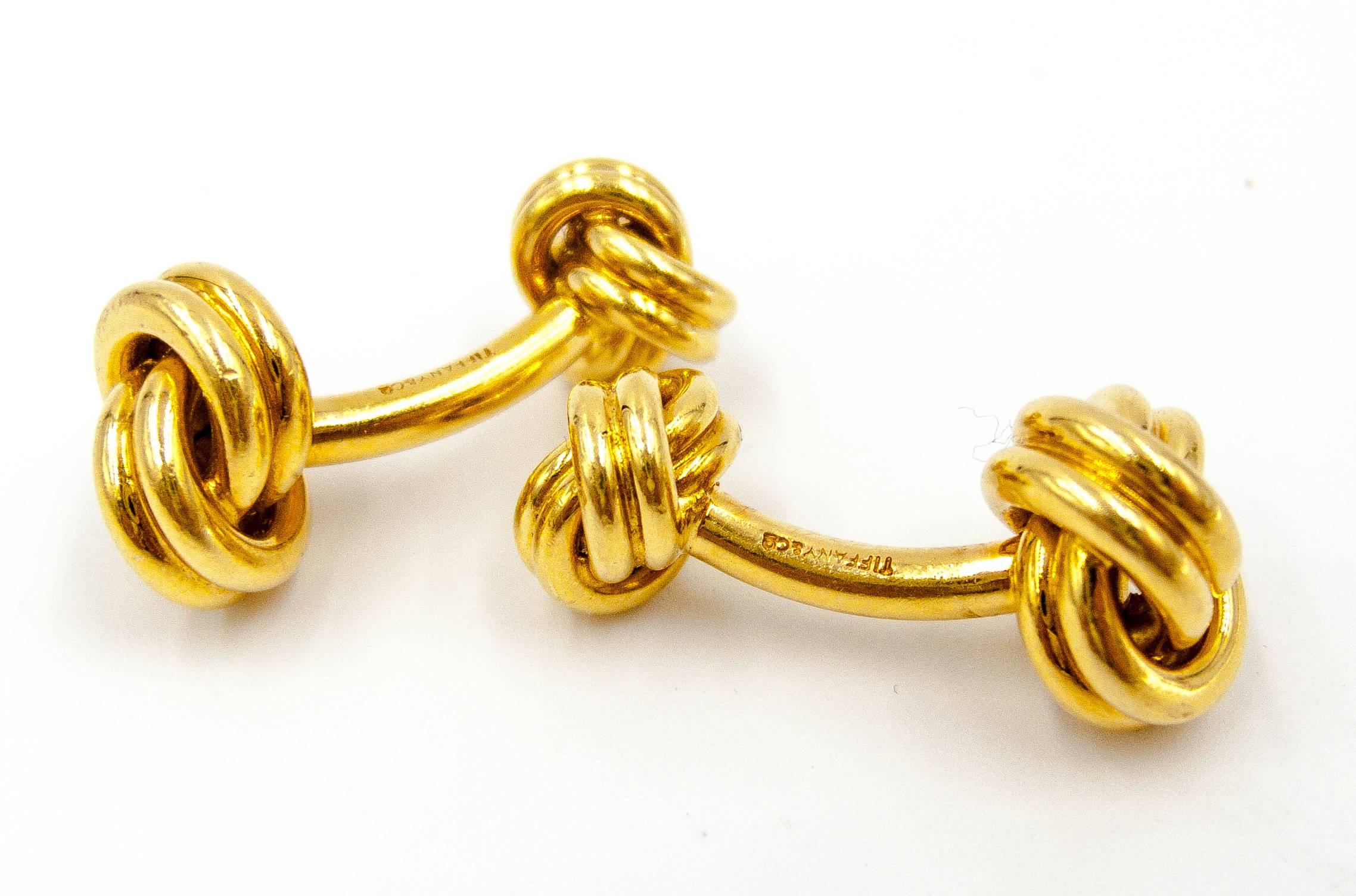 This classic Tiffany design has stood the test of time and will do so for decades to come.  The perfectly balanced knots are tethered by a curved tube of 18 karat gold to accommodate the buttonholes., The gold has a rich, soft sheen and the