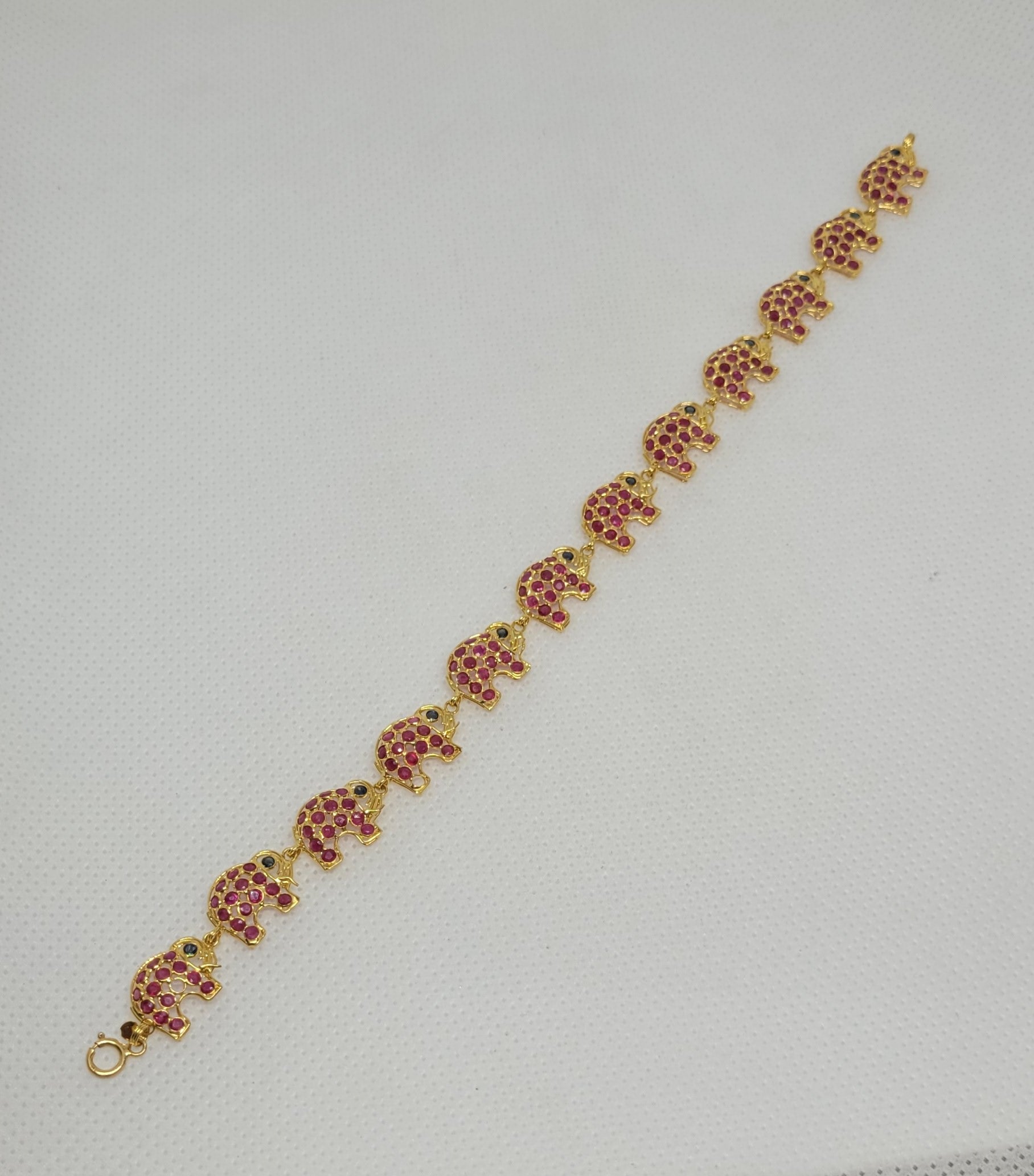 18kt Yellow Gold Ruby Sapphire Elephant Link Bracelet 7 Inches 10mm Wide 6 gr For Sale