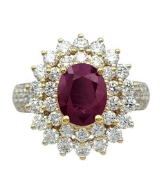 Oval Cut Ruby and Double Diamond Halo Cocktail Ring in 14 Karat Yellow Gold