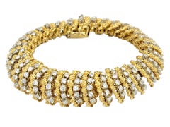 Bracelet vintage « Diamond Caterpillar » de la marque Hammerman Brothers, en or jaune 18 carats