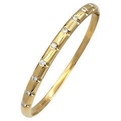 Notched Bangle Bracelet with Round Diamonds in 14 Karat Yellow Gold