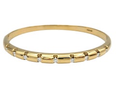 Notched Bangle Bracelet with Round Diamonds in 14 Karat Yellow Gold