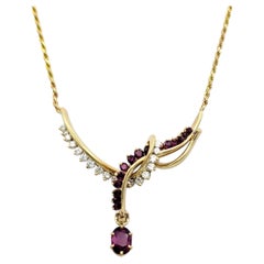 Ruby and Diamond Asymmetrical Swirl Motif Drop Necklace in 14 Karat Yellow Gold