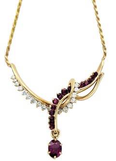 Ruby and Diamond Asymmetrical Swirl Motif Drop Necklace in 14 Karat Yellow Gold
