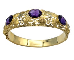 Cutout Floral Motif Hinged Bangle Bracelet with Amethyst in 18 Karat Yellow Gold