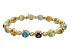 Pulsera Effy con eslabones circulares y piedras preciosas multicolores en oro amarillo de 14 quilates