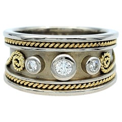 Three Diamond Band Ring with Twisted Scroll Motif in Two-Toned 18 Karat Gold
