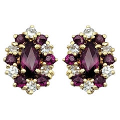 Marquise Shaped Ruby and Diamond Halo Stud Earrings in 14 Karat Yellow Gold