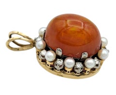 Oval Cabochon Fire Opal Pendant with Diamond and Pearl Halo 14 Karat Yellow Gold