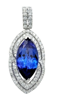 Ciondolo con tanzanite taglio marquise e doppio halo di diamanti in oro bianco 14 carati