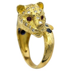Panther Motif Bypass Ring with Blue Sapphires, Rubies, & Diamonds 18 Karat Gold