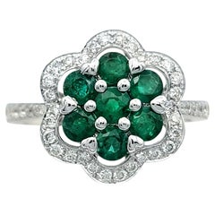 Round Cut Emerald and Pavé Diamond Flower Ring in 14 Karat White Gold