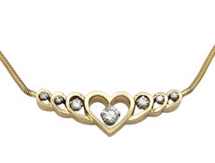 Graduated Open Heart Snake Chain Necklace with Diamonds in 14 Karat Yellow Gold