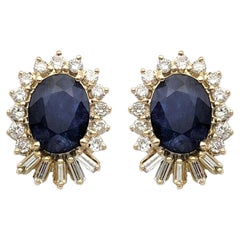 Oval Cut Blue Sapphire and Diamond Stud Earrings in 14 Karat Yellow Gold