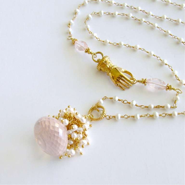 Pétales de Rose II Necklace - 
A delicate blush pink and diaphanous kisses-cut rose quartz 33 carat briolette is crowned with a frothy explosion of creamy white button pearls to create a traditional, yet uniquely feminine pendant. This ladylike