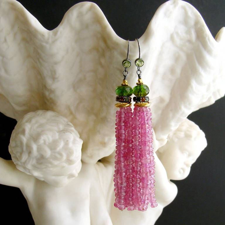 Evangeline Earrings - 
Seriously flirty and fun tassel earrings in pink topaz have been crowned by the most adorable little multicolored tourmaline rondelles and rich green tourmaline beads to create this years “must have” jewelry.  The mixed