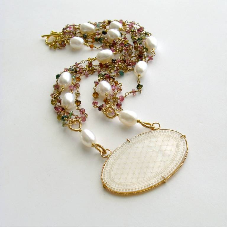 A-Monogram Tourmaline Necklace - MOP Game Counter -Watermelon Tourmaline - Baroque Pearls - Le Jeton III Necklace.

A beautiful and delicately carved Chinese gaming counter (circa 1810) has been re-purposed into the centerpiece of an equally