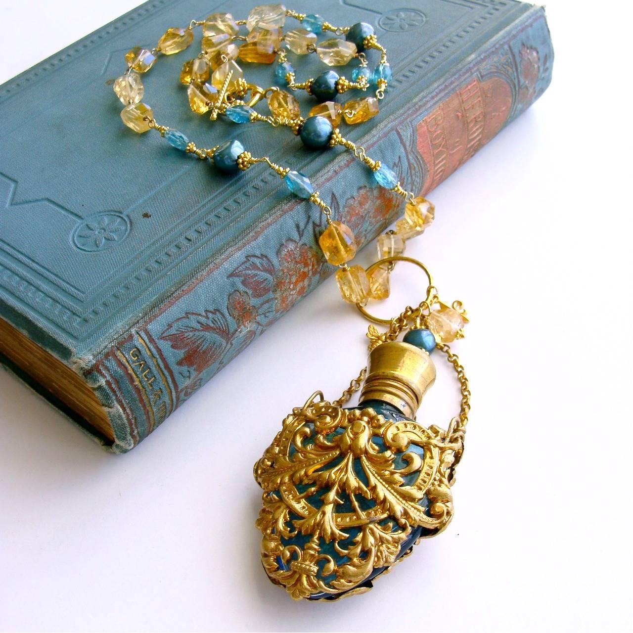 Rosalie Necklace.

The history of perfume during the Regency and Victorian Eras is a fascinating subject and this delicate necklace pays homage to the creativity and workmanship of that time.

A Victorian teal scent bottle (c. 1900) encased with