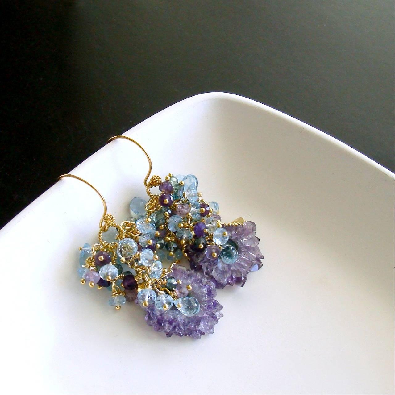 Seanna Earrings.

One of Mother Nature’s curiosities, amethyst stalactite slices have become the focal point of these jaw dropping cluster earrings. These delicate and spiny slices are gently nestled amongst ethereal clusters of dark and pink