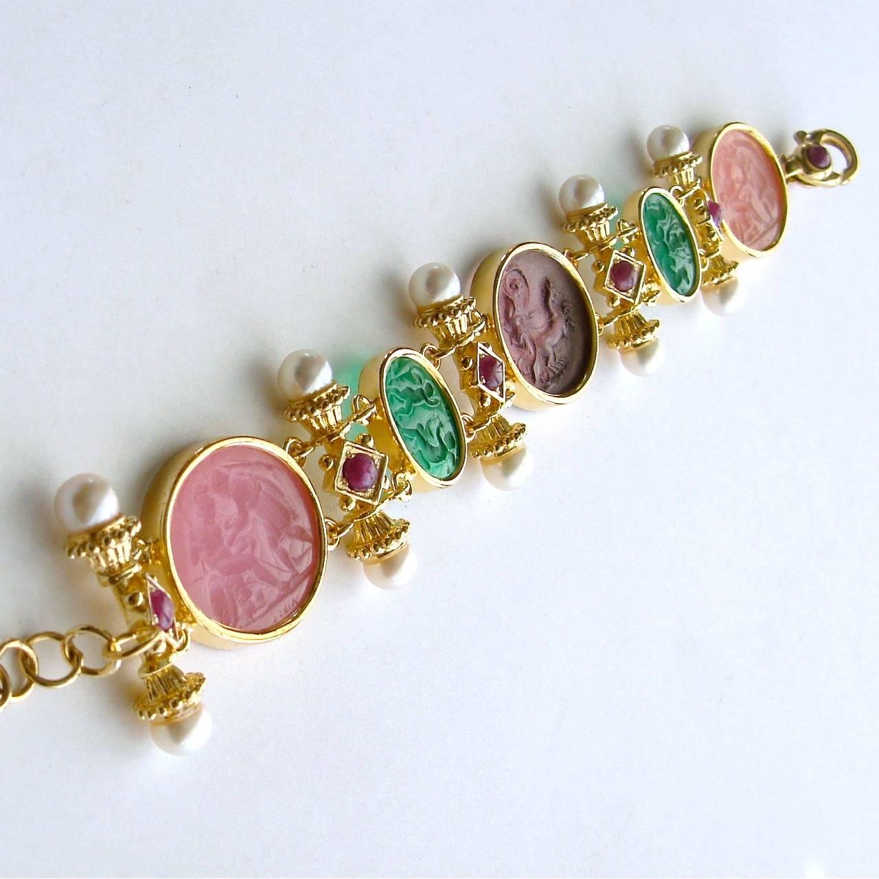 Castelsardo Intaglio Bracelet.

Neoclassical Venetian glass intaglios in gorgeous Spring colors have been artfully separated with Byzantine styled bars, featuring creamy pearls and ruby cabochons.  The generous lobster claw closure has also been