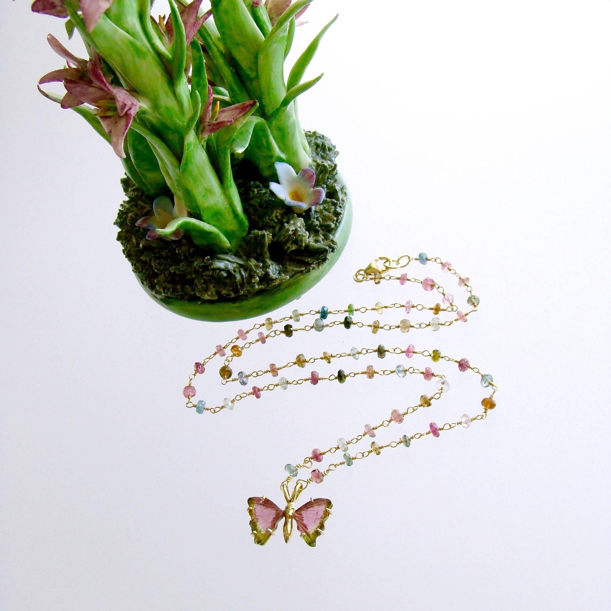 Le Papillon VI Necklace.

This remarkable butterfly pendant with pastel watermelon tourmaline wings in grass green and watermelon pink, was designed to showcase the unique beauty of the tourmaline slices and mounted in an 18k gold frame.  It has