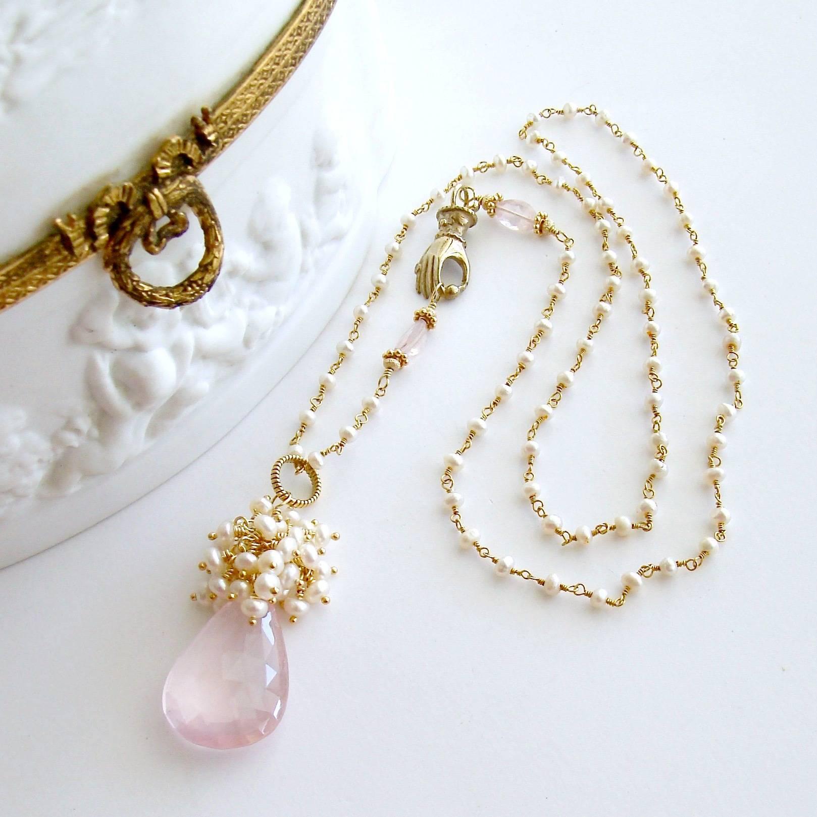 Pétales de Rose III Necklace.

A delicate blush pink and diaphanous faceted briolette pear-cut rose quartz briolette is crowned with a frothy explosion of creamy white button pearls to create a traditional, yet uniquely feminine pendant. This