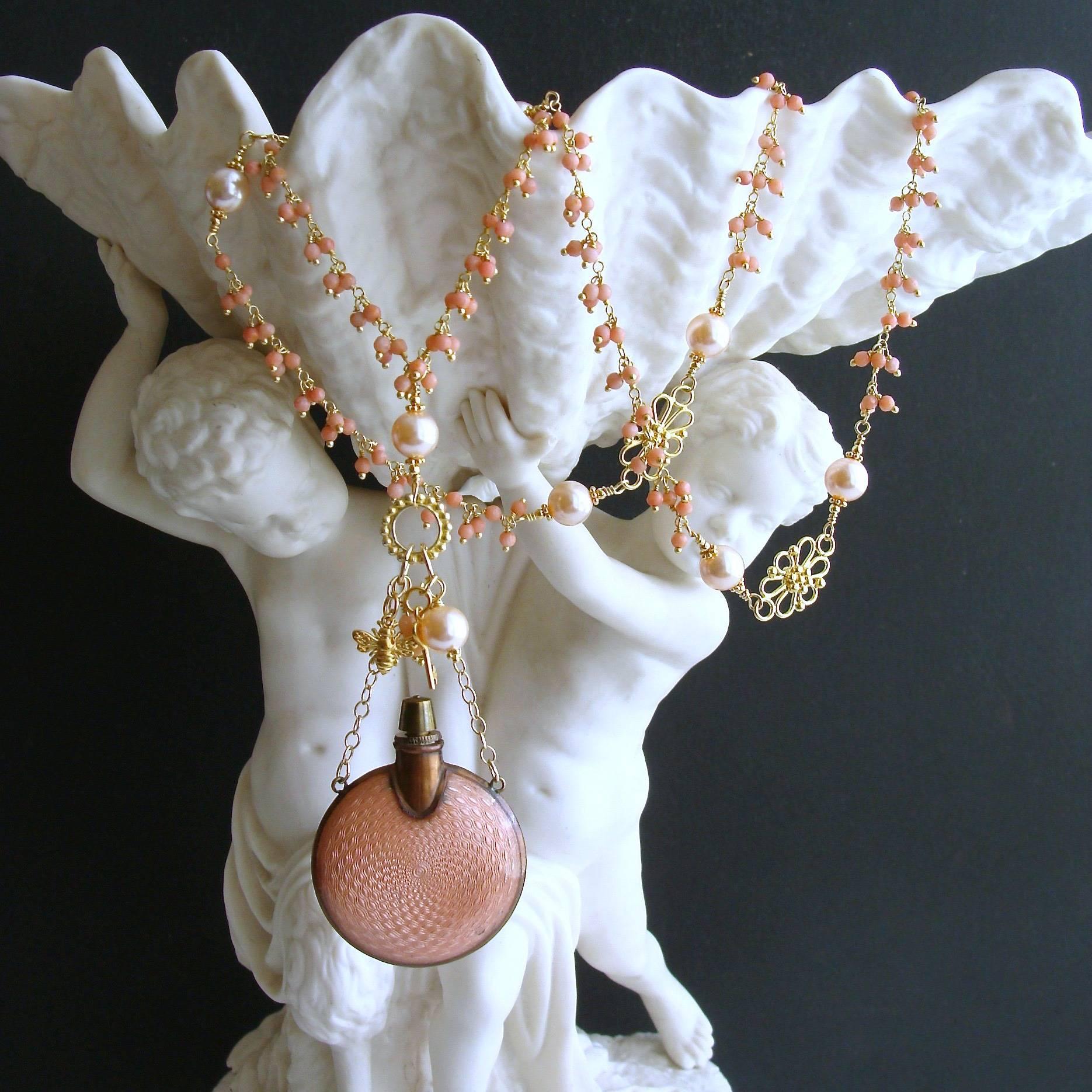 Aline Necklace.

A long and sinewy cluster necklace of coral has been intercepted with delicate gold vermeil filigree connectors, flanked by softly lit peach glass pearls.  This beautifully colored peach sunrise design, culminates with a gorgeous