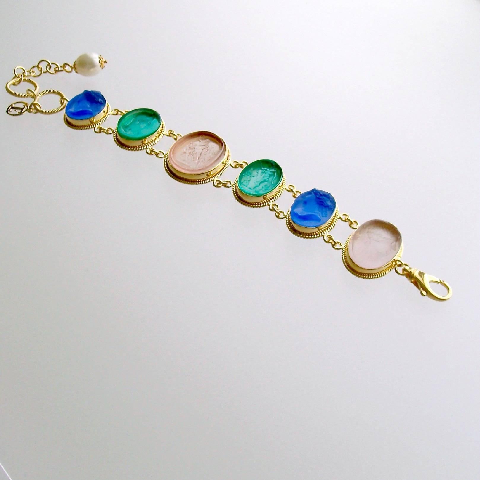 Belluno Bracelet.

A stunning collection of  Venetian glass cameo/intaglios in lapis blue, emerald green and blush pink, have been married together to create this classic bracelet.  Each of the gorgeous intaglios/cameos sits in bezeled mountings