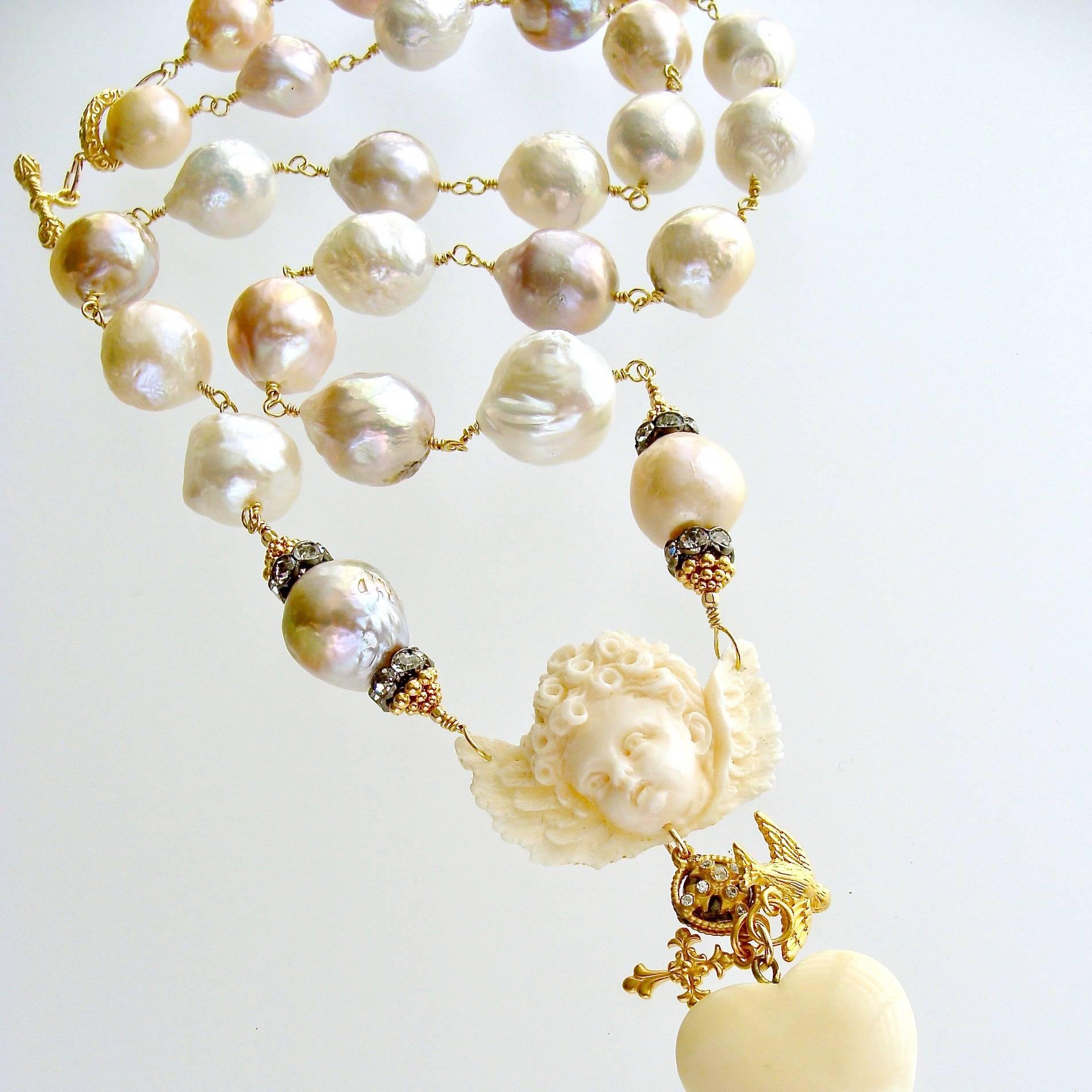 Mon Ange Chéri Necklace.

A silky smooth large graduated strand of multi-colored pink, peach, white, mauve and taupe baroque pearls - is the dreamy basis of this heavenly necklace design.  These naturally colored craggy baroque pearls are hand