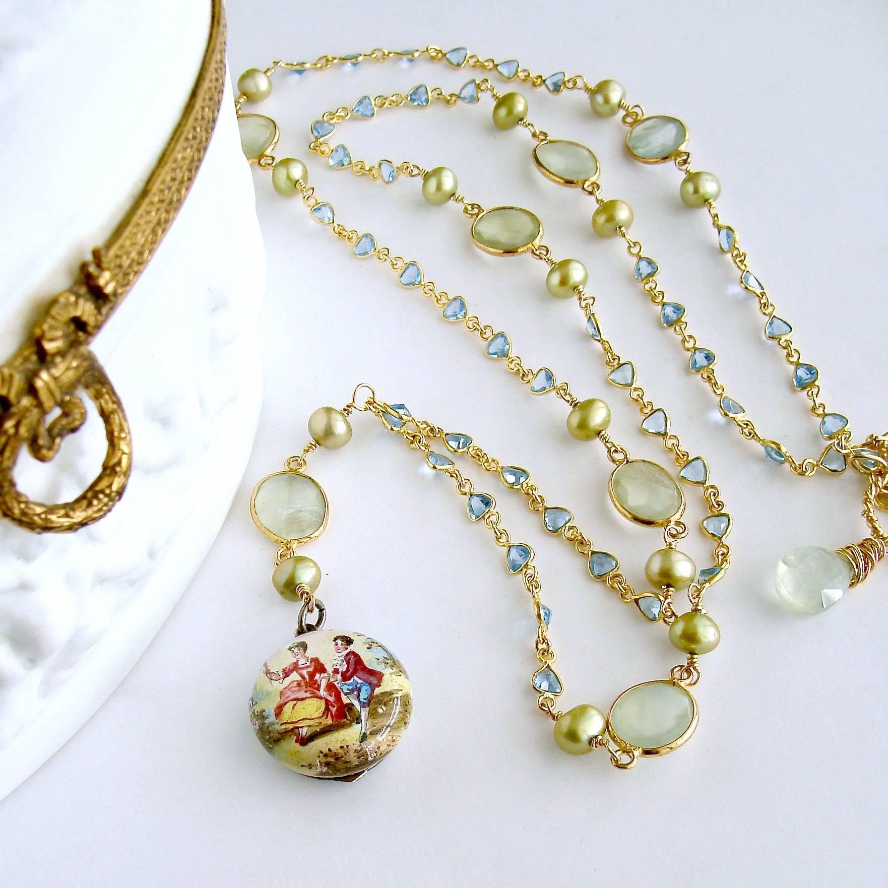 Brezza Floreale II.

A charming pastoral Samuel Goldfarb antique Viennese enamel vinaigrette scent locket (circa 1900), is suspended from a linked chain of bezel set heart shaped and faceted blue topaz and intercepted with kiwi green pearls flanking