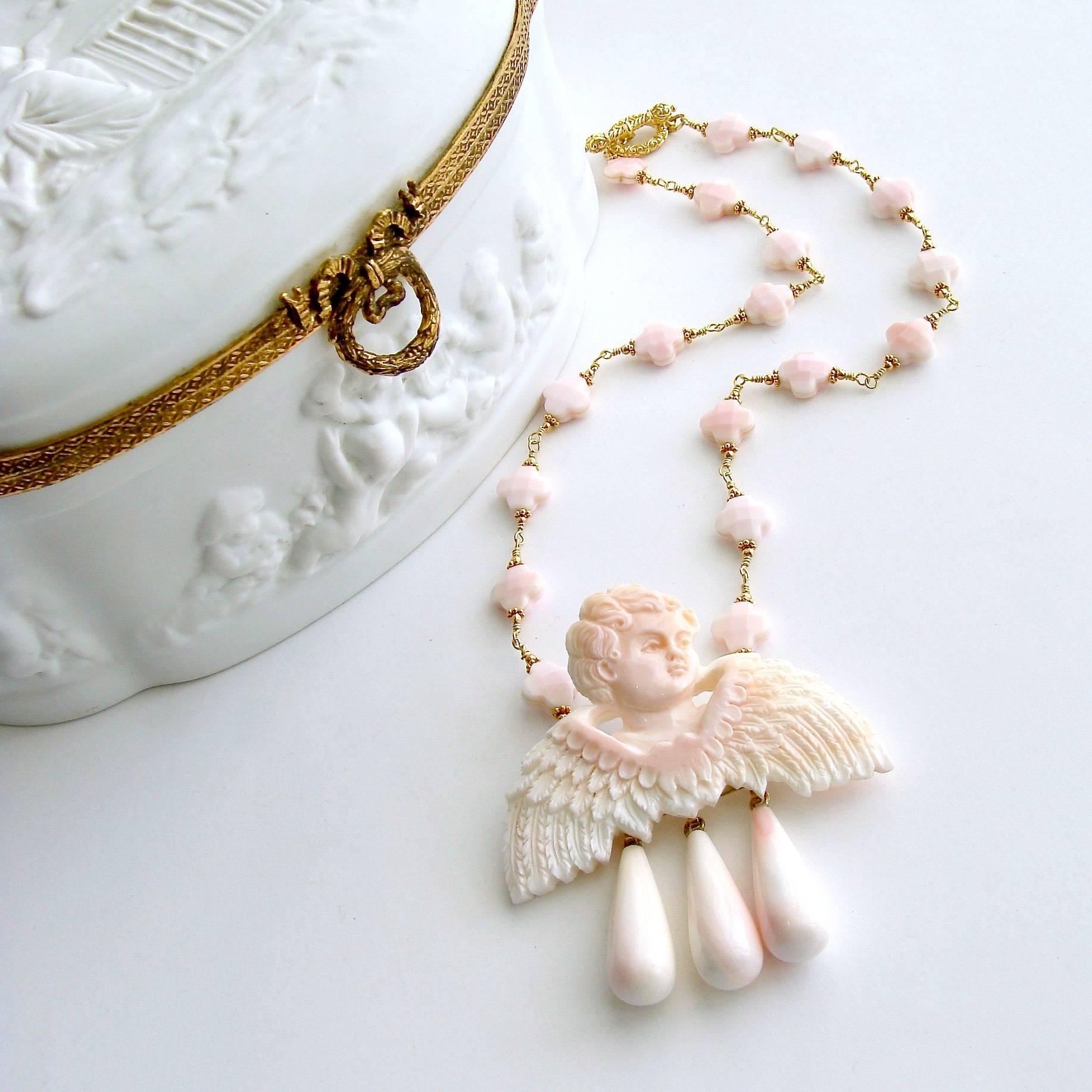 Amorette Necklace.

I have always been a fan of soft blush pink and recently have also become intrigued by little hand carved cherubin.  Since so many of the heirloom cherubs fall into a category that has been banned for sale, my attention has been