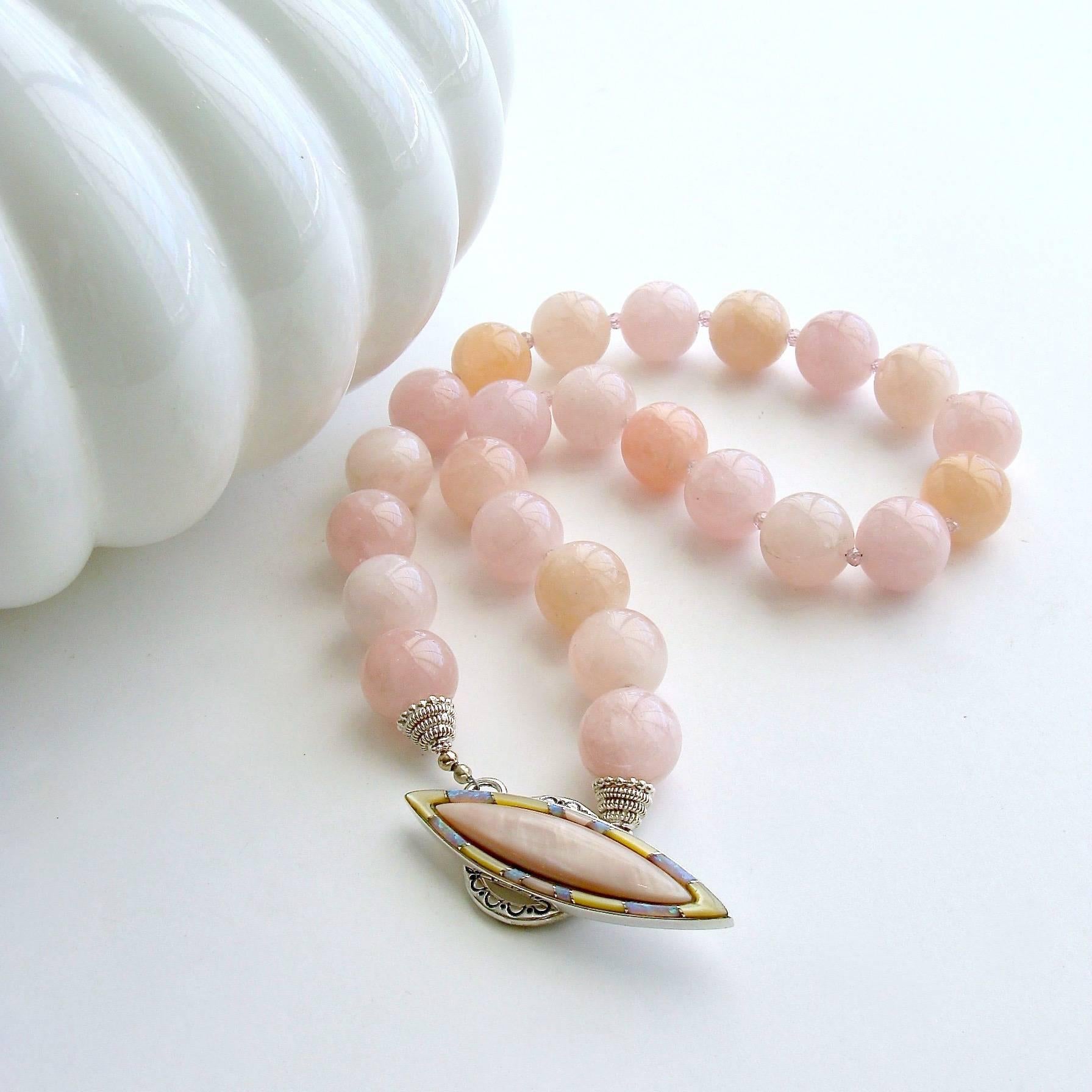 Dahlia III Necklace.

Varying shades of blush pink and pink grapefruit colored luxe morganite beryl beads are gently separated by pink zircon faceted rondelles to create a bountiful statement choker necklace designed to celebrate spring and summer