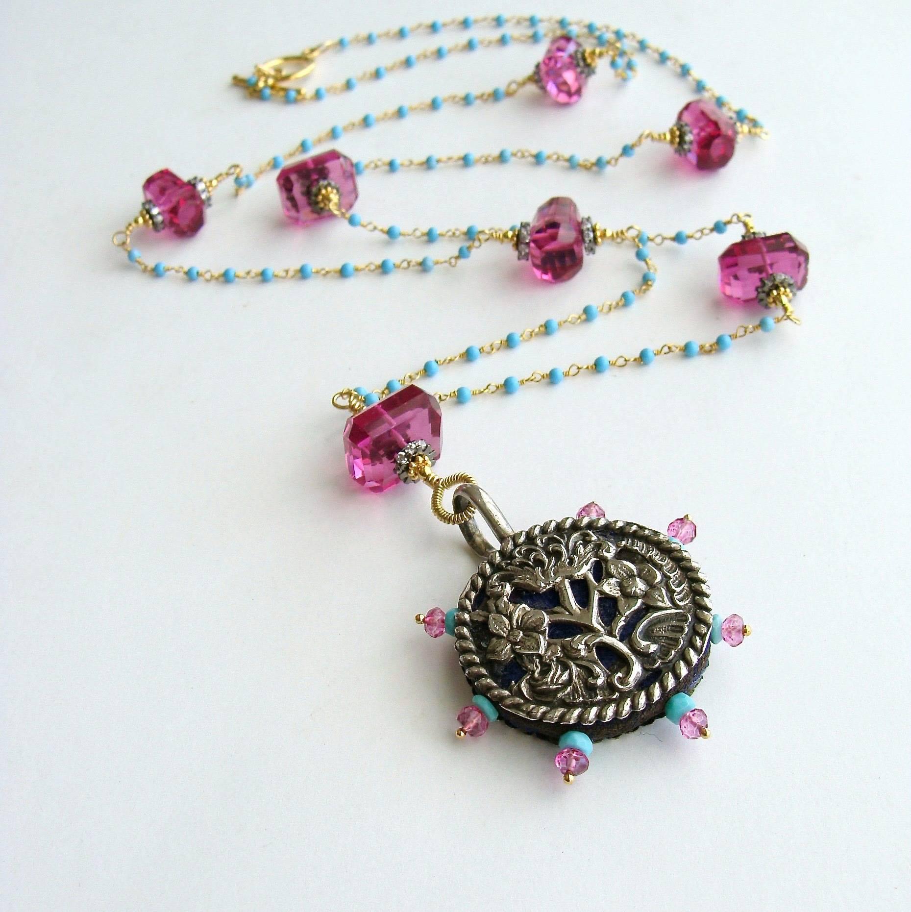 Serenity Necklace.

A beautiful silver English Victorian (c.1897) reticulated pin wheel, encrusted with Sleeping Beauty Turquoise and Pink Topaz - is the focal point of this charming long layering necklace.  These unique sewing etui were