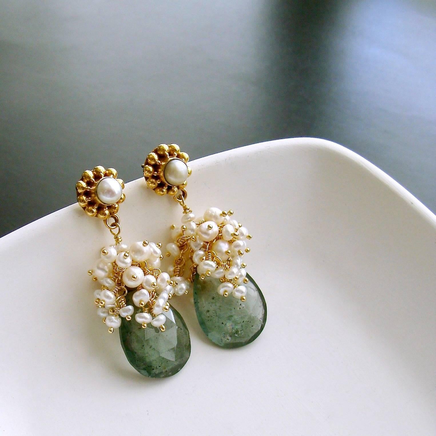 Les Fleurs de la Mer II Earrings.

Moss aquamarine is one of the most coveted stones - perhaps for its rarity or simply for its complex coloring - which almost defies description, but is best described as dusty aquamarine.  Gorgeous deep aquamarine