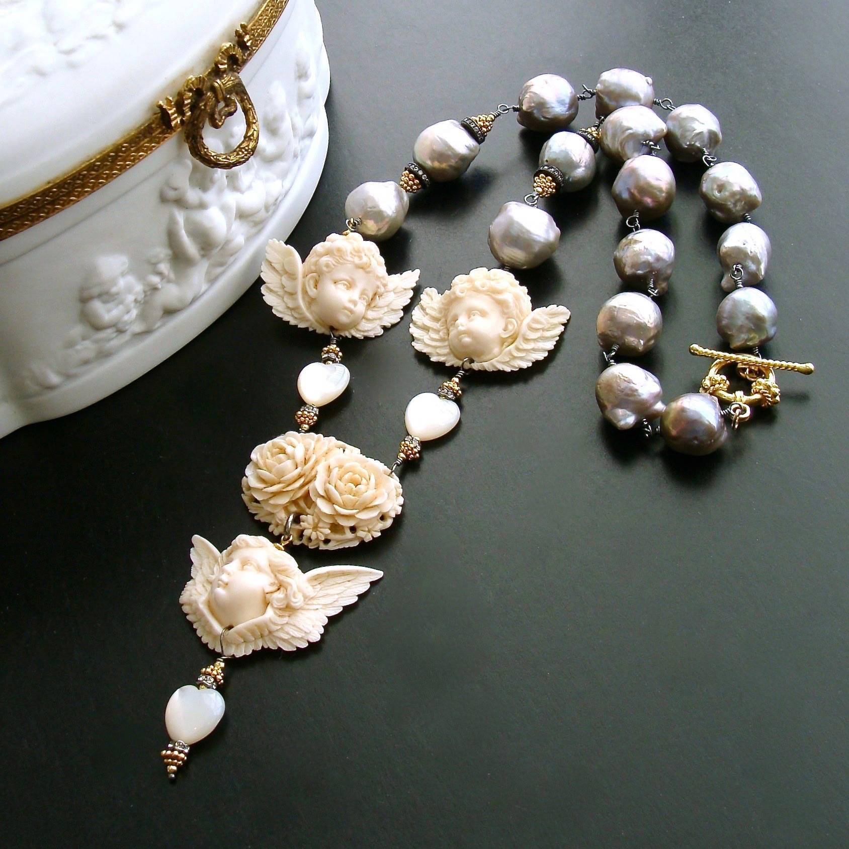 A silky smooth strand of large gray baroque pearls - is the dreamy basis of this heavenly necklace design.  These naturally colored craggy baroque pearls are hand linked in rhodium silver and feature mixed metals and crystal accents.  These generous