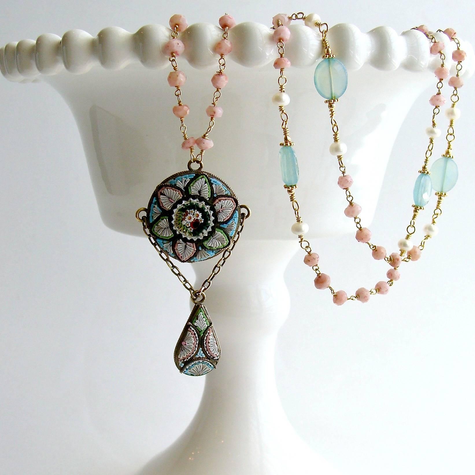 Floriana Necklace.

Delicate blush pink beads of pink Peruvian opal set a sweet and elegant  mood when paired with  stations of powdery aqua chalcedony, flanked by dimunitive button pearls.  A beautiful Victorian era micro mosaic pendant in matching
