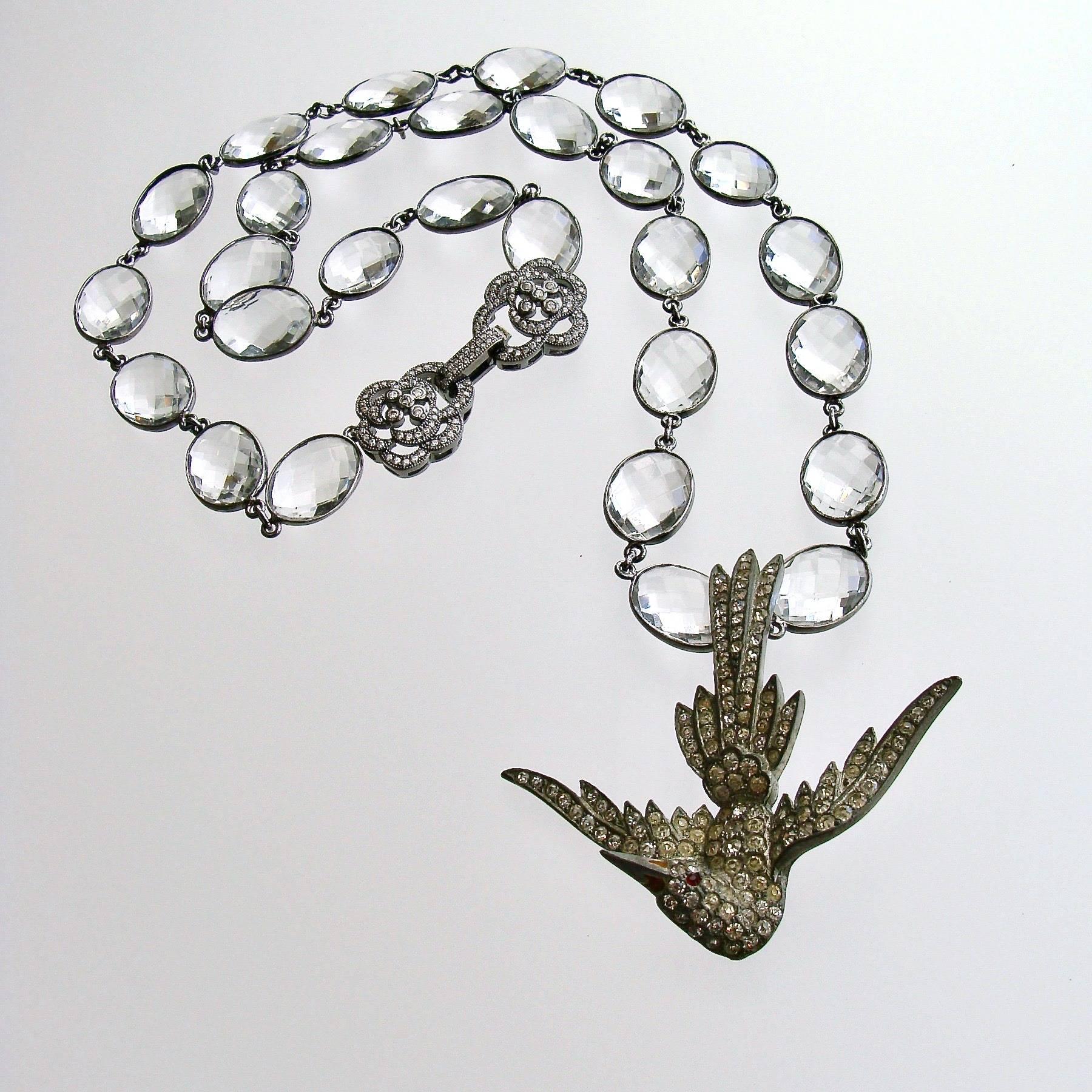 Saint Esprit II Necklace

An antique Victorian silver paste Saint Esprit dove pendant (circa 1850) descending from heaven with outstretched wings, dangles sweetly below an oxidized silver chain with bezel set teardrops of white topaz - repeating the