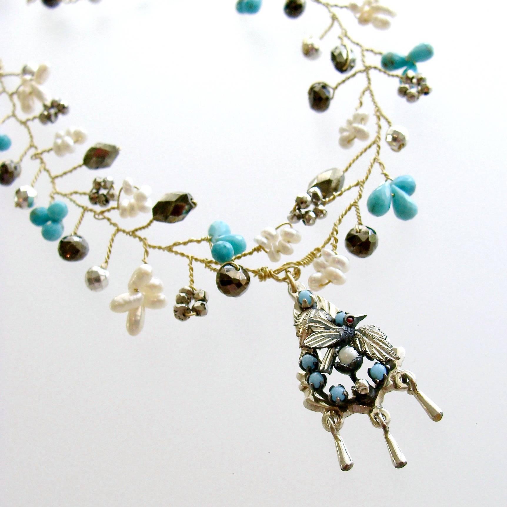 Pajaritos Flora Necklace.

A charming necklace with hand spun beads of micro turquoise teardrops and pearls, silver and natural pyrite - has been designed to replicate the flora and fauna of a woodland scene.  The mix of metals consisting of