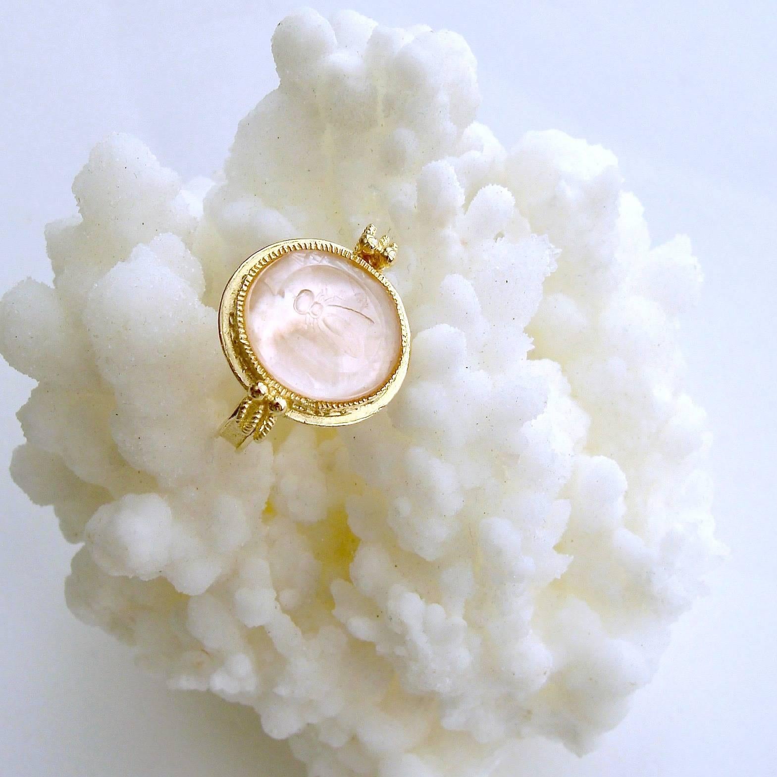 A dainty gorgeous ballet pink Venetian glass intaglio of a Napoleonic bee is the focal point of the charming ring.  This classic work of art has been backed with mother-of-pearl and is set in timeless neoclassical gold vermeil mounting.  The darling