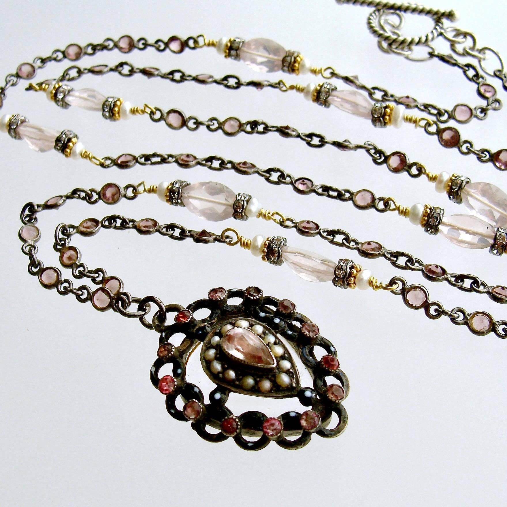 Micheline Necklace.

Delicate pink tourmaline has been bezel set in oxidized silver and intercepted with marquise cut rose quartz, flanked with seed pearls and crystal rondelles.  The beautiful confectionary coloring of the stones repeats the