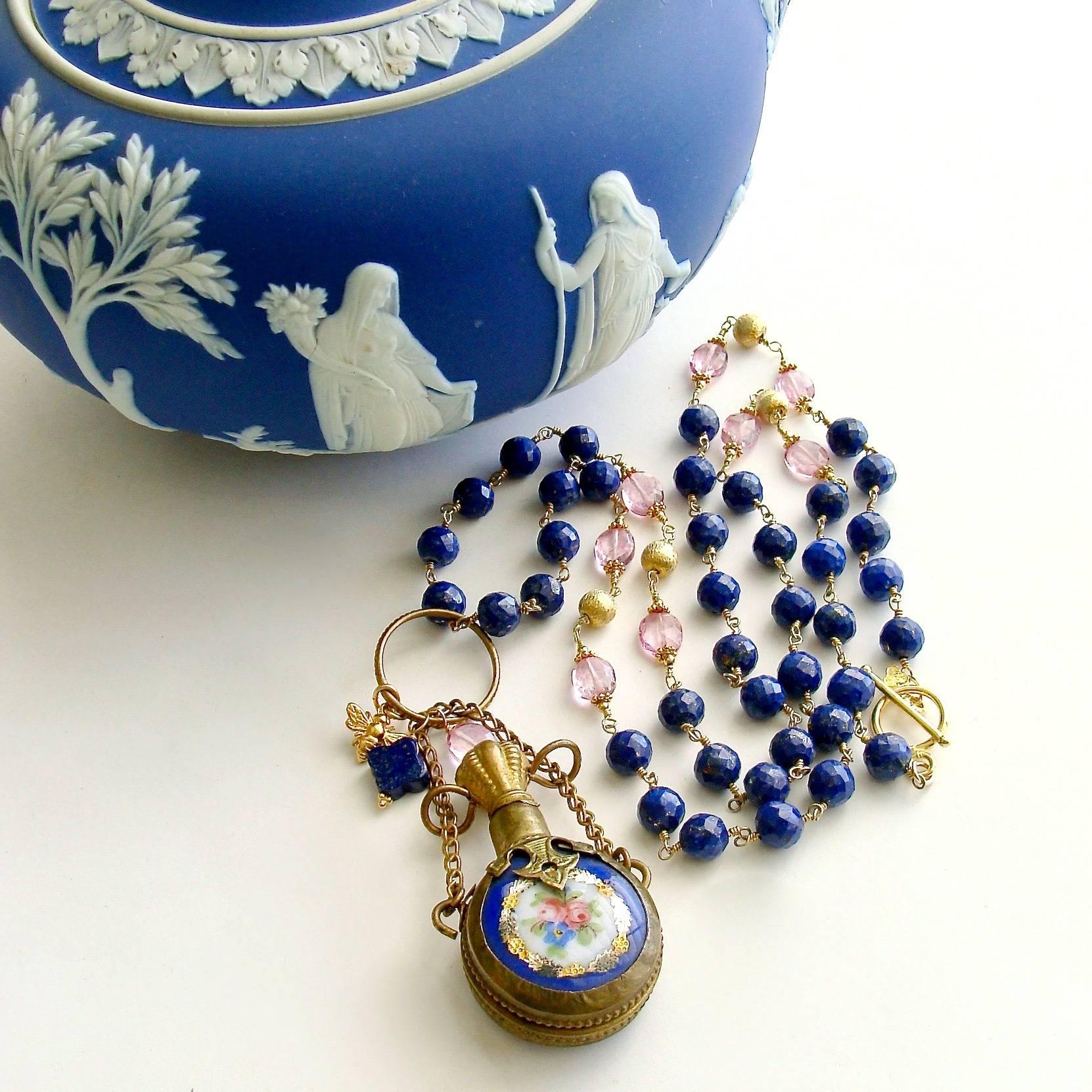 Lillian Necklace.

A long strand of beautiful cobalt blue faceted lapis beads are intersected with stations of brushed gold vermeil beads flanked by soft pink quartz oval beads.  The focal point of the necklace is the charming hand painted cobalt