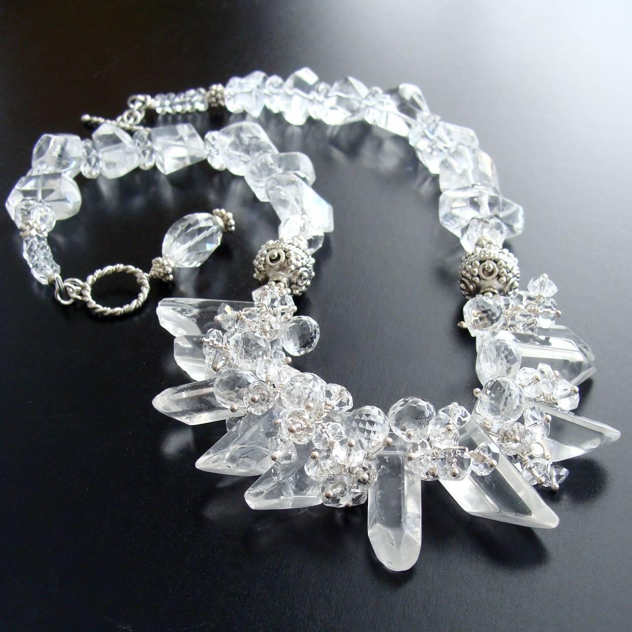 Krystal Necklace.

The icy beauty of this necklace - purely consisting of rock crystal nuggets and embellished with soft clusters of  rock crystal clusters nestled between ominous daggers - creates an oxymoron of the statement, “Minimalist Statement