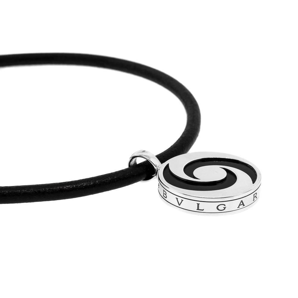 Distinctive & Sporty this Bvlgari pendant featuring two crescent enamel symbol pendant, suspended from a leather cord.  It is quite a statement.