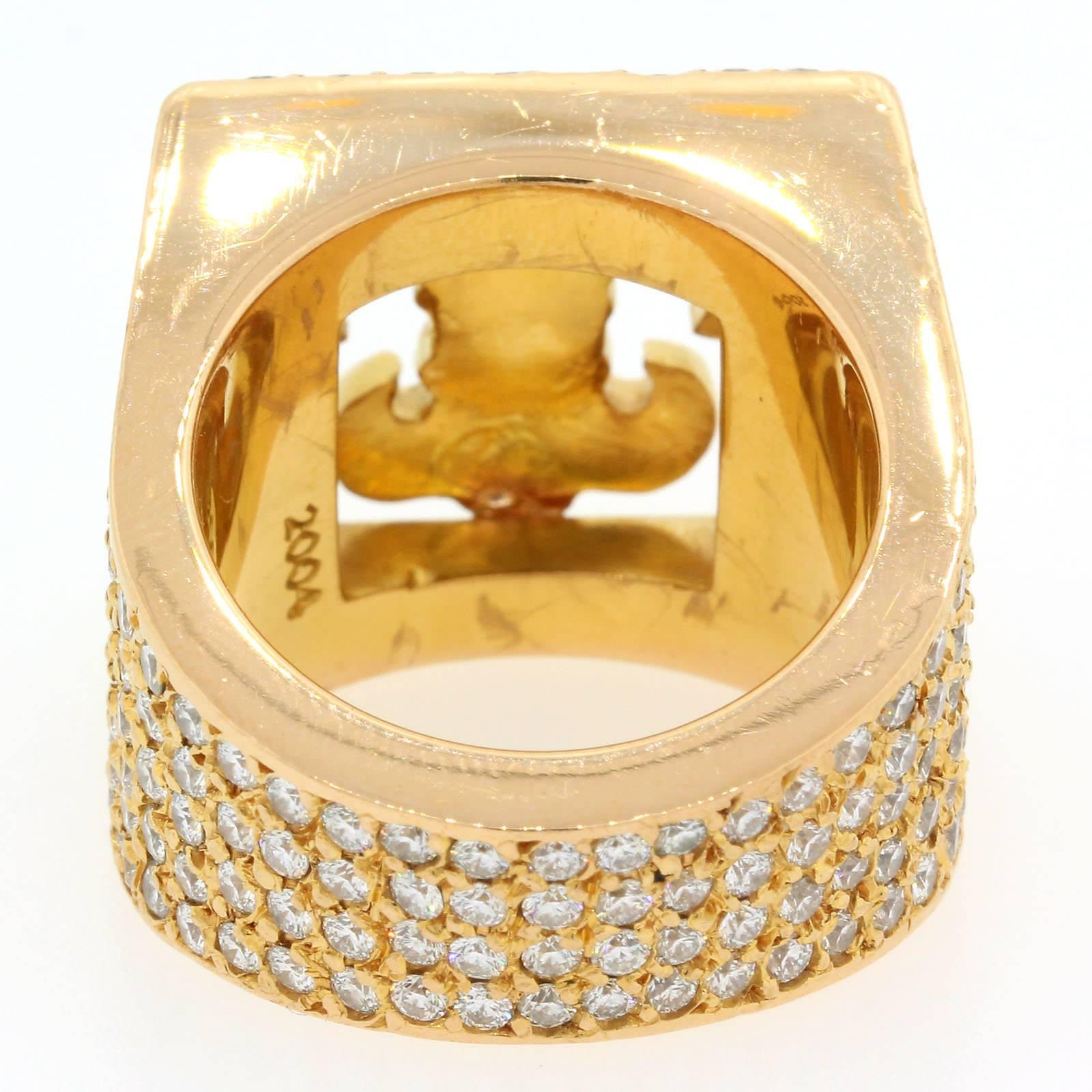Brilliant, Sparkly & Fashionable this Chrome Hearts Fleur de Lis emblem 22KT gold ring flashes  5.50 carats of Round Brilliant Cut Diamonds.  Two Princess Cut Diamonds accent the Fleur de Lis. 